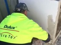 Worker applying texture coating